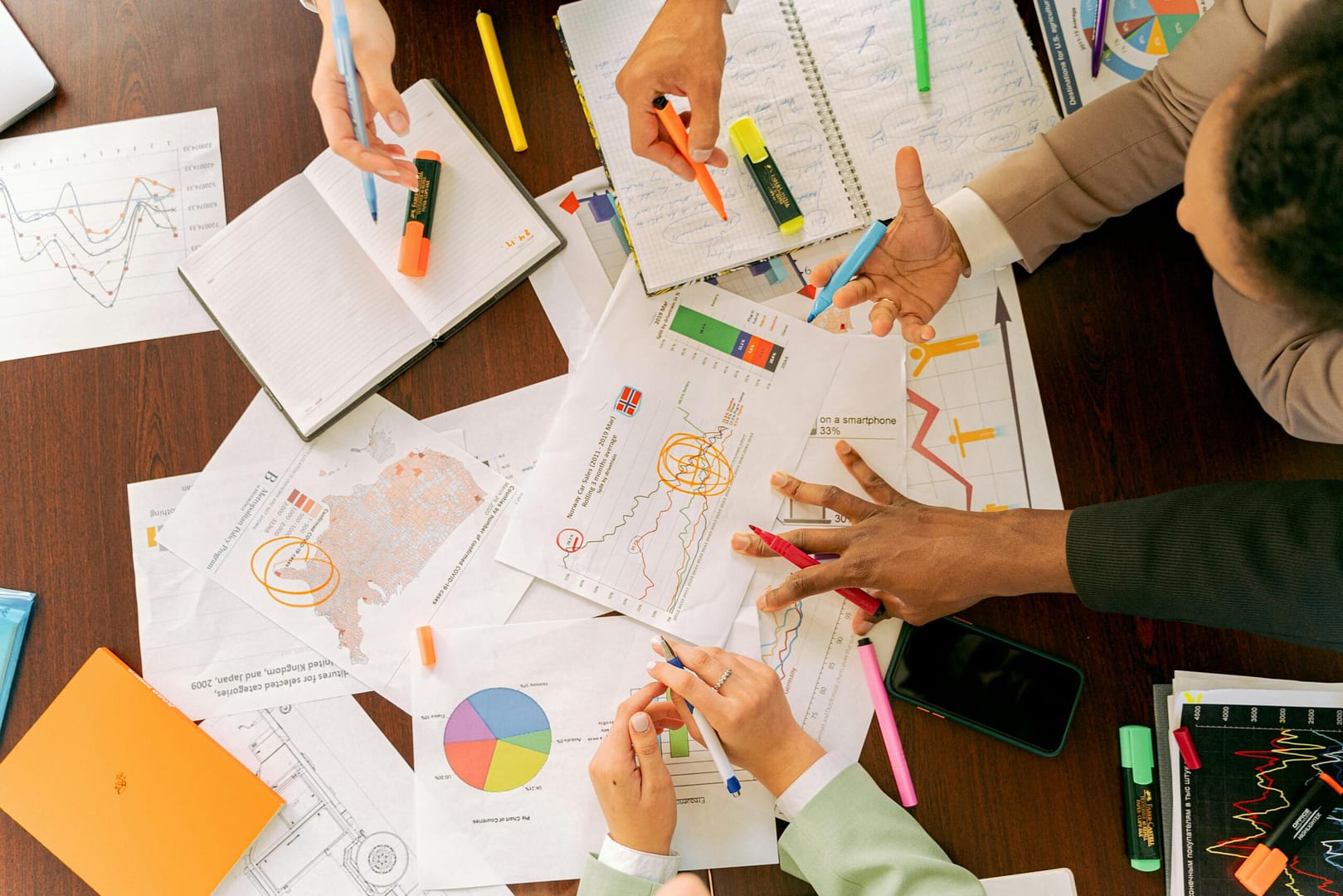 Business meeting with a table full of paper